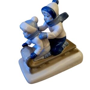 Paul Sabastian Porcelain Figurine of Children Boys Sledding Pastel Colors